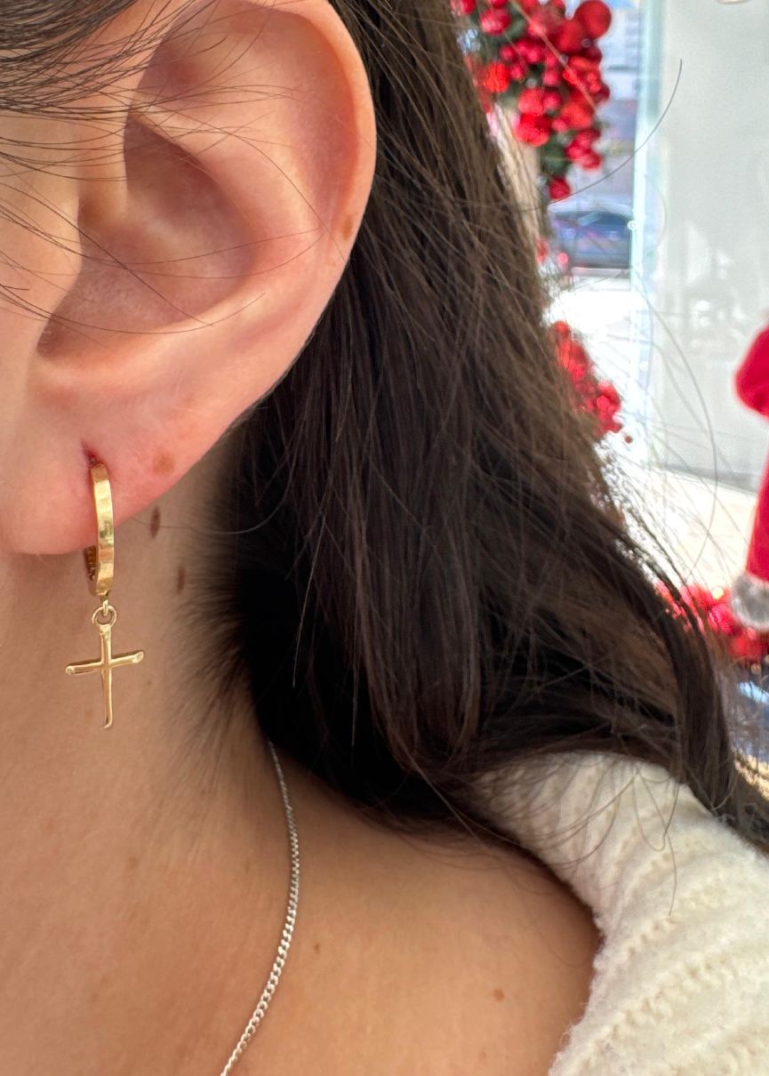 Huggies c/cruz colgante