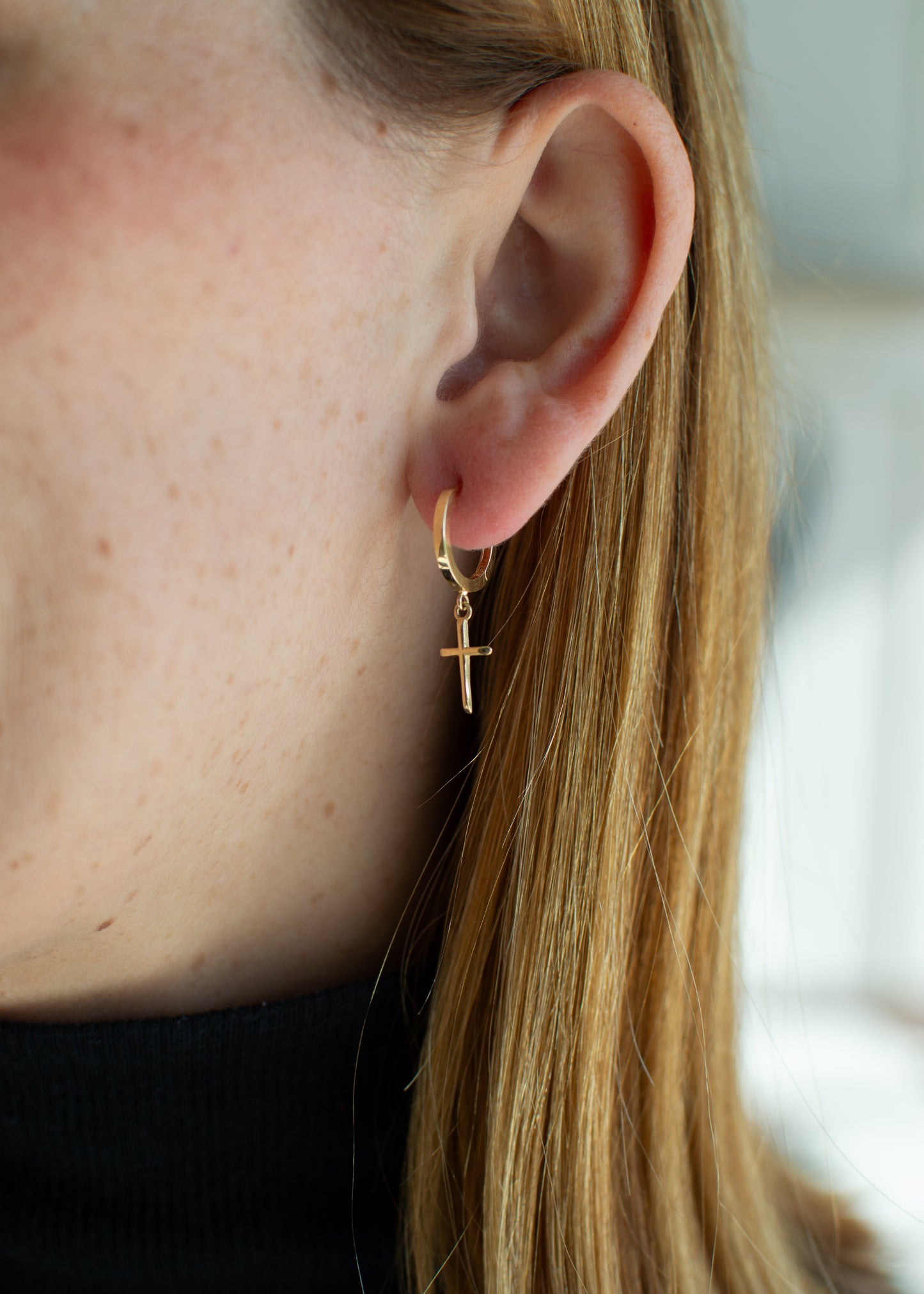 Huggies c/cruz colgante